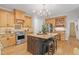 Well-equipped kitchen features granite counters, modern appliances, and ample storage space at 314 Chanticlair Dr, Apex, NC 27502
