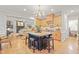 Open kitchen layout with a large island, modern appliances, and seamless access to living area at 314 Chanticlair Dr, Apex, NC 27502