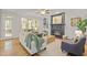 Inviting living room features a cozy fireplace, built-in shelves, and lots of natural light at 314 Chanticlair Dr, Apex, NC 27502