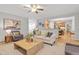 Spacious open concept living room features a cozy seating area and access to kitchen at 314 Chanticlair Dr, Apex, NC 27502