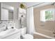 Cozy bathroom with tub and shower and white vanity sink at 3315 Mebane Oaks Rd, Mebane, NC 27302
