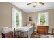 Bedroom featuring windows offering lots of natural light and dresser at 3315 Mebane Oaks Rd, Mebane, NC 27302