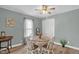 Charming dining area features a round table and bright natural light at 3315 Mebane Oaks Rd, Mebane, NC 27302