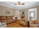 Warm living room with hardwood floors and a traditional style sofa at 3315 Mebane Oaks Rd, Mebane, NC 27302