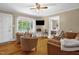 Bright living room featuring wood floors and a view into the bedroom at 3315 Mebane Oaks Rd, Mebane, NC 27302