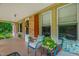 Inviting covered front porch with seating and charming decorative touches at 3315 Mebane Oaks Rd, Mebane, NC 27302