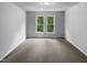 Bedroom with natural light from double windows and neutral carpet at 3509 Neptune Dr, Raleigh, NC 27604