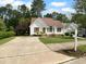 Charming home with a well-manicured front yard and traditional curb appeal at 3509 Neptune Dr, Raleigh, NC 27604