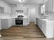 Bright kitchen featuring sleek stainless-steel appliances and ample white cabinetry at 3509 Neptune Dr, Raleigh, NC 27604
