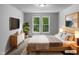 Serene main bedroom featuring large windows and contemporary decor for relaxation at 3509 Neptune Dr, Raleigh, NC 27604