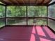 Enjoy serene views from the screened porch, perfect for relaxing outdoors at 3509 Neptune Dr, Raleigh, NC 27604