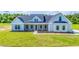 Inviting home with a well-kept lawn and a charming front entrance at 355 Shaw Rd, Cameron, NC 28326