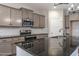 Modern kitchen featuring granite counters, stainless steel appliances, and ample cabinet space at 355 Shaw Rd, Cameron, NC 28326