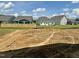 Large backyard with an unfinished landscape, perfect for creating a custom outdoor oasis at 40 Commons Cir, Clayton, NC 27520