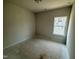 Simple bedroom with neutral walls and a single window, ready for personal touches and decor at 40 Commons Cir, Clayton, NC 27520