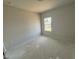 A bedroom with a window showcasing the home's neutral wall paint and flooring at 40 Commons Cir, Clayton, NC 27520