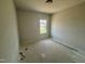 A bedroom with a window showcasing the home's neutral wall paint and flooring at 40 Commons Cir, Clayton, NC 27520