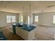 Bright and airy kitchen with a large island, pendant lighting, and ample natural light at 40 Commons Cir, Clayton, NC 27520