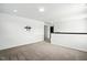 Empty bonus room with neutral carpet and white walls at 409 Kilcornac Ct, Fuquay Varina, NC 27526