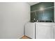 The laundry room features white walls, a dark accent wall, and a wire shelf at 409 Kilcornac Ct, Fuquay Varina, NC 27526