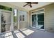 This screened porch features a ceiling fan, and access to the backyard at 409 Kilcornac Ct, Fuquay Varina, NC 27526