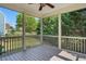 This screened porch features a ceiling fan, and a view of the yard at 409 Kilcornac Ct, Fuquay Varina, NC 27526