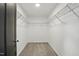 Walk-in closet with neutral carpet and wire shelving at 409 Kilcornac Ct, Fuquay Varina, NC 27526
