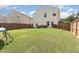 This wide open backyard has ample green space and wood privacy fence at 4401 Lyman Ave, Raleigh, NC 27616