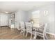 Bright dining area with a view of the front entry at 4401 Lyman Ave, Raleigh, NC 27616