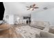 Open-concept living area with wood-look floors and dining area access at 4401 Lyman Ave, Raleigh, NC 27616