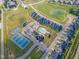 Aerial view showcasing community layout with pool, tennis and basketball courts, and residential area at 470 E Wellesley Dr, Clayton, NC 27520