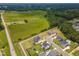 Expansive aerial view showing homes in a suburban neighborhood surrounded by lush greenery at 470 E Wellesley Dr, Clayton, NC 27520