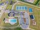 Aerial view of community amenities featuring a pool, tennis courts, basketball court, and playground at 470 E Wellesley Dr, Clayton, NC 27520