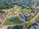 Aerial view of neighborhood with baseball fields, open spaces, and convenient community amenities at 470 E Wellesley Dr, Clayton, NC 27520