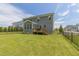 Expansive fenced backyard with a well-maintained lawn and wooden deck, perfect for outdoor enjoyment at 470 E Wellesley Dr, Clayton, NC 27520