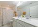 Charming bathroom with double vanity, bright lighting and colorful polka dot shower curtain at 470 E Wellesley Dr, Clayton, NC 27520