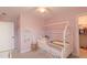 Adorable pink bedroom features a house frame bed and cute decor at 470 E Wellesley Dr, Clayton, NC 27520