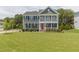 Charming two-story home with a manicured lawn, double porches, and an inviting front entrance at 470 E Wellesley Dr, Clayton, NC 27520