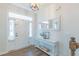 Bright foyer with light-colored walls, hardwood floors, and a staircase, adjacent to the front entrance at 470 E Wellesley Dr, Clayton, NC 27520