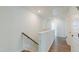 Upstairs hallway featuring hardwood floors, neutral paint, and access to bedrooms at 470 E Wellesley Dr, Clayton, NC 27520