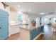 Open kitchen features stainless appliances, center island, breakfast area, and seamless flow to living room at 470 E Wellesley Dr, Clayton, NC 27520