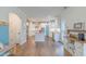 Eat-in kitchen with island, stainless appliances, and hardwood floors throughout the open space at 470 E Wellesley Dr, Clayton, NC 27520