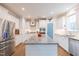 Bright kitchen boasts stainless appliances, granite countertops, and a center island at 470 E Wellesley Dr, Clayton, NC 27520