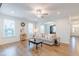 Bright and airy living room featuring modern decor, arched doorways, and hardwood floors at 470 E Wellesley Dr, Clayton, NC 27520