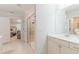 Bright main bathroom featuring a walk-in shower with a bench and a single sink vanity at 470 E Wellesley Dr, Clayton, NC 27520