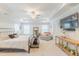 Bright main bedroom with a tray ceiling, a ceiling fan, a large TV, and lots of natural light at 470 E Wellesley Dr, Clayton, NC 27520