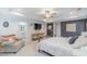 This spacious main bedroom features a tray ceiling, a ceiling fan, and a flatscreen TV at 470 E Wellesley Dr, Clayton, NC 27520