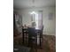 Comfortable kitchen dining area with stainless steel refrigerator and natural light at 4721 Mocha Ln, Raleigh, NC 27616