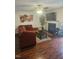 Inviting living room with fireplace, mounted TV, and hardwood floors at 4721 Mocha Ln, Raleigh, NC 27616