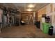 Unfinished basement with exposed duct work, ladder, and various equipment at 4810 Glenmist Ct, Raleigh, NC 27612